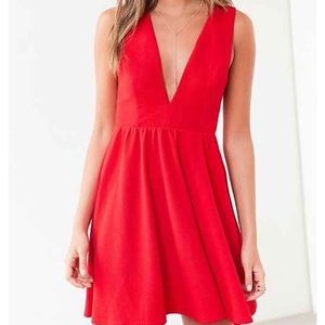 Lucca Couture fit and flare with plunging neckline